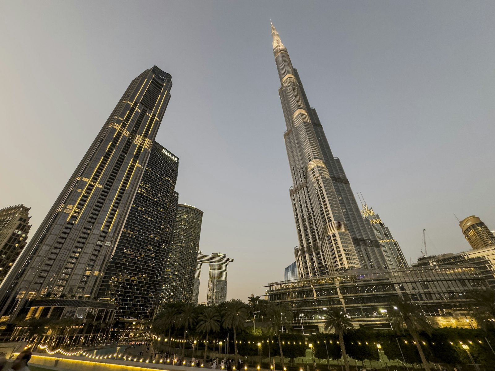 Dubai skyline with modern towers and warm evening light.